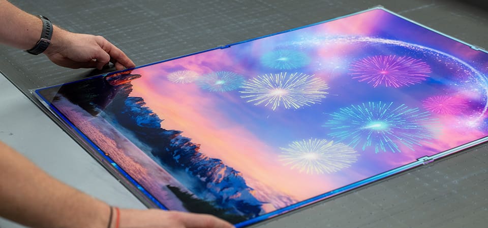 An example of Wicked Brick's printed backgrounds which is a colourful mountain range and coloured fireworks and an arch of magic in the sky