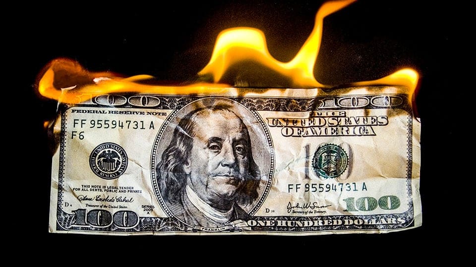 “Offensive” ad campaign banned for showing US dollars burning | SignLink